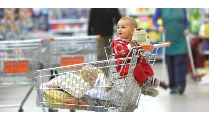 child on a shopping cart