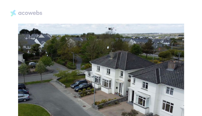 Manna drone lowering a paper bag with groceries by rope during a delivery to a house in Oranmore